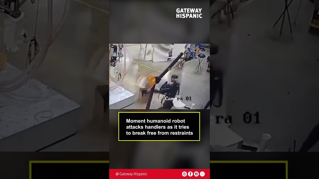 Moment humanoid robot attacks handlers as it tries to break free from restraints
