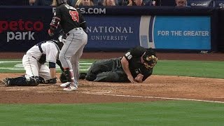 MIA@SD: Home-plate umpire shaken up after being hit