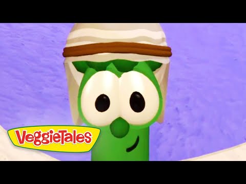 Larry the Cucumber from VeggieTales, wearing a white hat with a brown band, against a purple background.