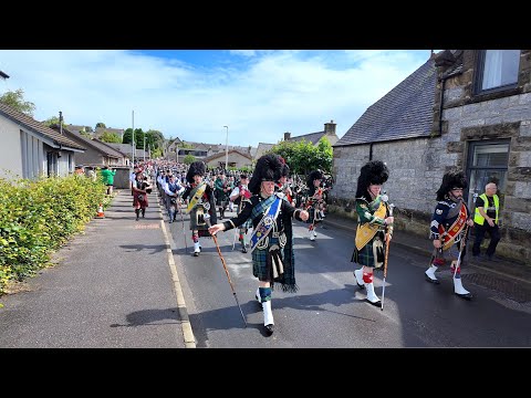 Chieftain leads the march with hundreds of pipers and drummers to 2024 Dufftown Highland Games