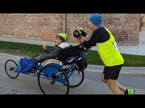 Couple teams up for their fifth marathon together: Him on foot, her on duo bike