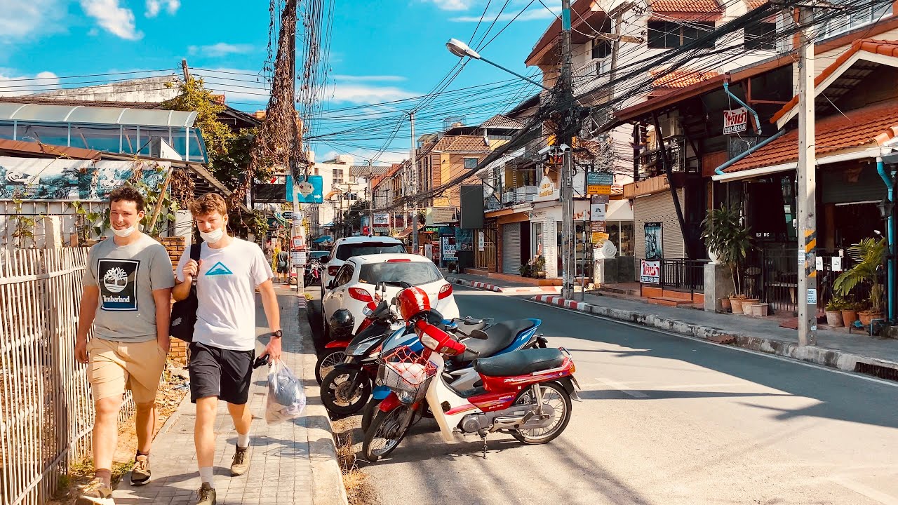 Immersive street-level walking tour through Chiang Mai, Thailand, showcasing authentic urban landscapes, local architecture, and the vibrant atmosphere of the city's neighborhoods