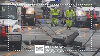 Car crashes into utility poles, knocking out power to dozens in Lawrence