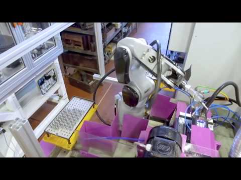 COMAU Racer-3-0.63 in machine tending application - FIRAD