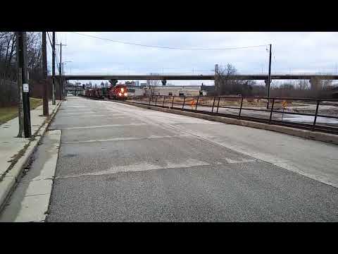 CP 281 with CP SD70ACU 7003 leading past the cut-off in Milwaukee