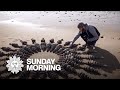 Land artist Jon Foreman, whose canvas is a beach