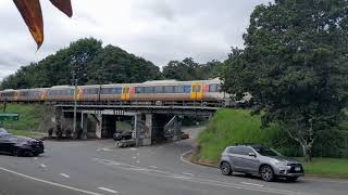 Queensland Rail's NGR unit 739 works run D536 towards Palmwoods station on a rail-over-road bridge