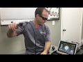 Dr. Dan explaining laser therapy for pain relief at Preferred Chiropractic in Round Lake Beach