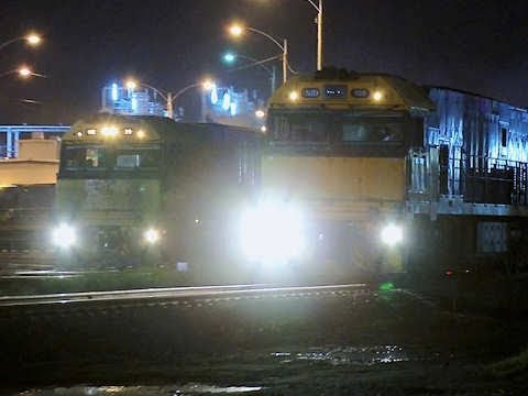 Two trains pace each other in Dynon freight yards - Australian railroads and trains