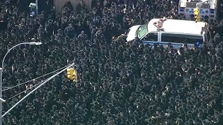Thousands crowd Brooklyn streets for grand rabbi&#39;s funeral; 2 officers hurt