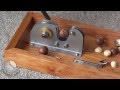 CRACKADAMIA Macadamia nut Cracker in action - 'Deluxe Base Cracker' DEFAULT Thumbnail