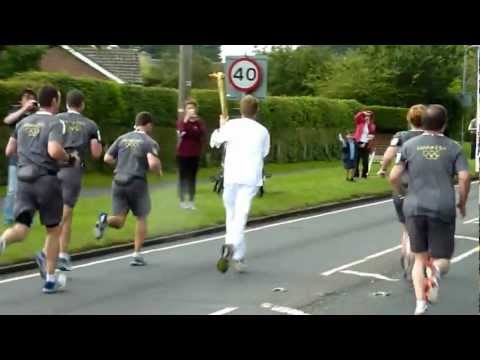 Barney Smith carries the Olympic torch