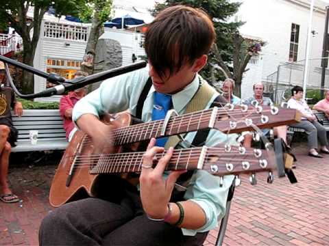 Ben Pegg on a double-neck acoustic guitar in Provincetown 2009
