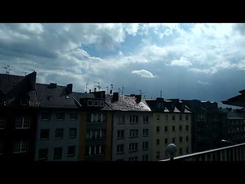 Its raining/snowing on the Bright Sunny Day in Aachen, Germany