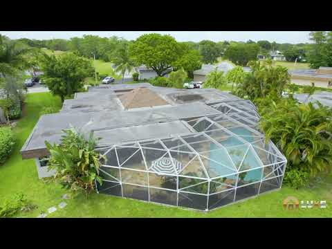 6106 Royal Poinciana Lane | Tamarac, FL 33319 | Breathtaking Lakefront Pool Home