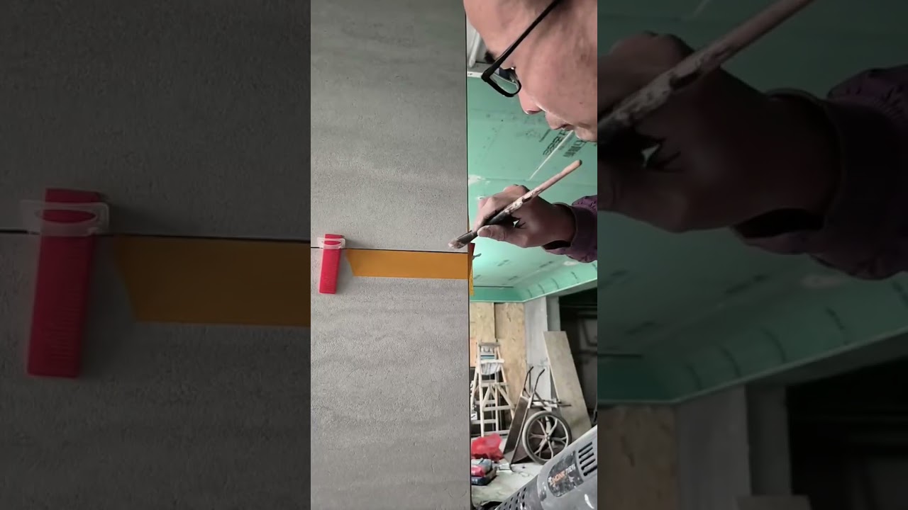 the process of adding white cement mixture to ceramics in the corners of hollow walls #construction