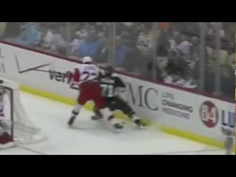 Brad Stuart crunches Evgeni Malkin