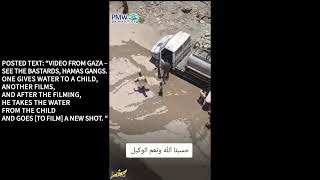 Hamas taking water away from a boy after doing a photo-op with him