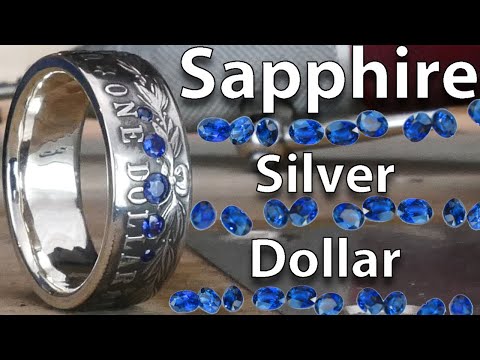 Flush setting Sapphires into a Morgan Dollar Coin Ring