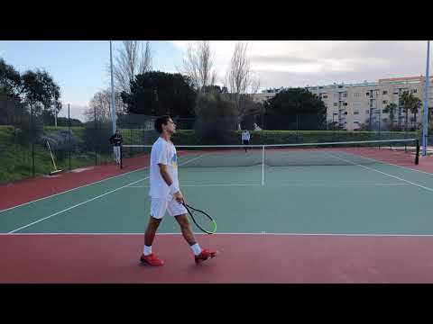 Court level view of Quentin Halys practicing with Pedro Araújo in Lisbon