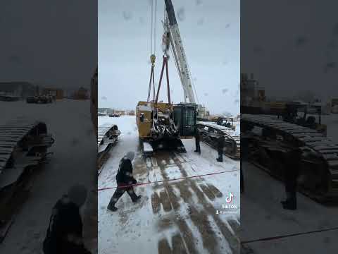 Awesome timelapse video from the crane’s view of our CAT 6015B getting lifted off the trailer…