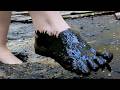 Girl Walks Barefoot Through Dirty Deep Mud