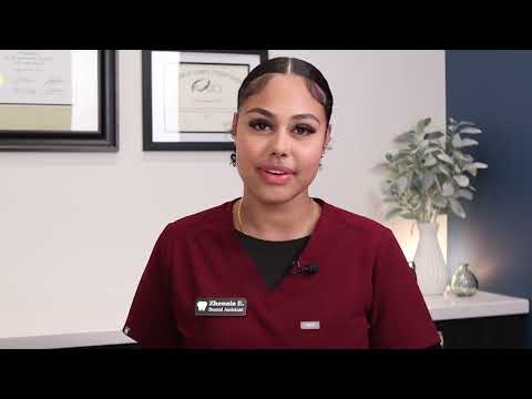 Phoenix dental team member in red scrubs