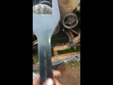 Removing fan clutch with removal tool wrench set