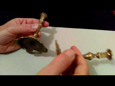 TWO NICELY AGE PATINATED MINIATURE BRASS CANDLESTICKS in EARLY GEORGIAN STYLE.