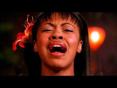 Trailer image of cast members clustered around microphones during the benefit show