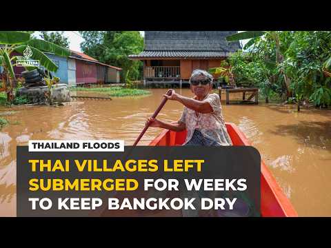 Thailand floods leave villages submerged to keep Bangkok dry