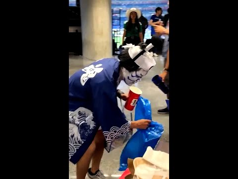 Japanese fans clean up stands after celebrating World Cup win