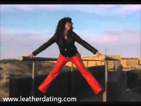 Brunette in red leather pants and black leather jacket