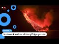 Lava komt in oceaan, grote rookwolken boven zee