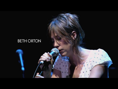 Performance close-up from the Cohen tribute with spotlight and minimal set