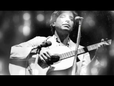Documentary trailer frame showing onstage spotlight over a Cohen tribute performer