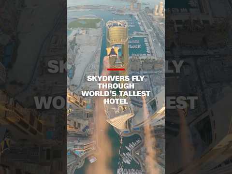 Skydivers fly through world’s tallest hotel