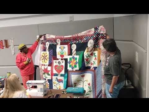 Rachel Clark receiving quilt at PIQF2022