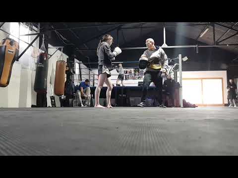 DCA fighter Jade hitting pads.