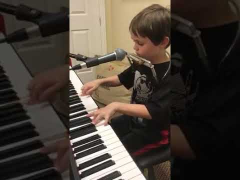 Piano, harmonica playing & singing kid