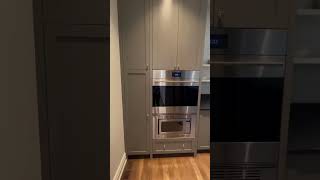 Step through the beautiful custom French door into this  walk-in pantry and kitchen