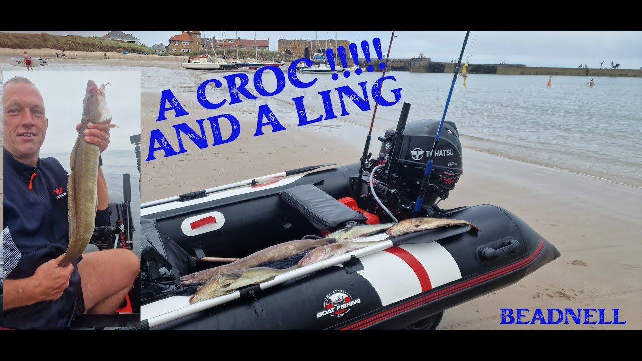 A man on a Hydrus Inflatable boat holding up a Ling fish with the text 'A Croc and a Ling'