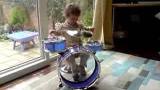 2 Year old drumming to Rudimentary Peni.