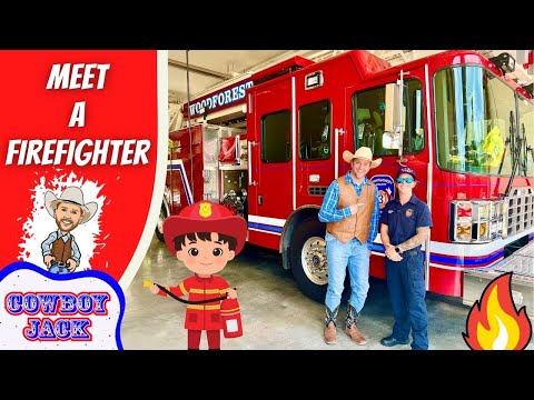 Event at a fire station: a red fire truck with two people posing beside a cartoon cowboy and firefighter stickers in the foreground.
