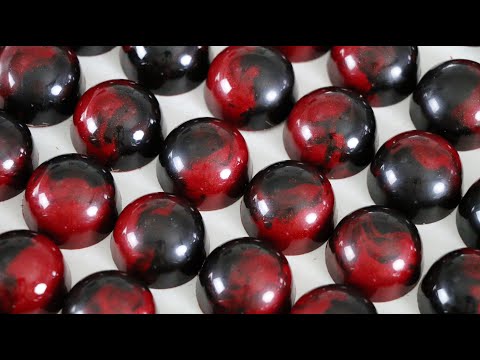 Chocolate Bonbon Design | Black and Red Sparkle Swirl
