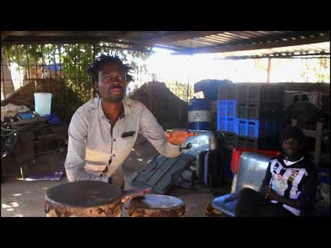 Duramazwi mbira group members display their drum playing skills