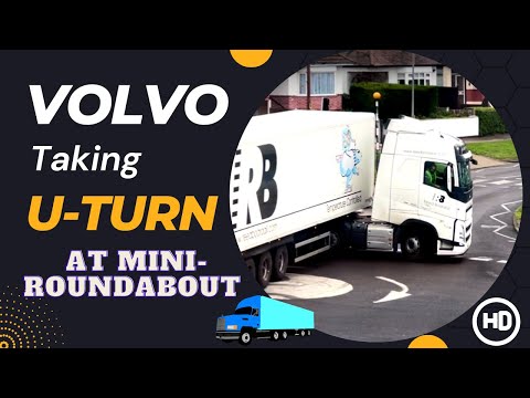 VOLVO Lorry with trailer taking a U-turn at a mini-roundabout