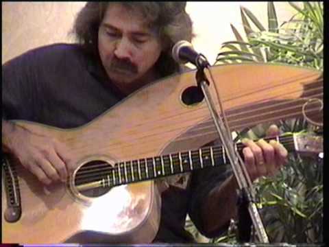 Stephen Bennett 1999, CAAS, playing harp guitar.