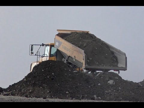 Volvo A35E, Volvo A35G & CAT 735C Tipping Their Loads