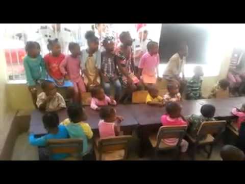 Children Sing at Le Main Divine Orphanage in Croix-des-Bouquets, Haiti, to Greet United Nations police officers who support the orphanage